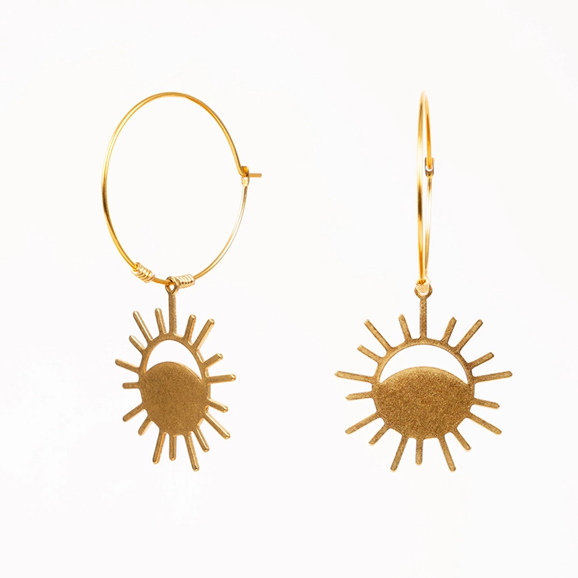 brass hoop earrings with eclipse charm on bottom