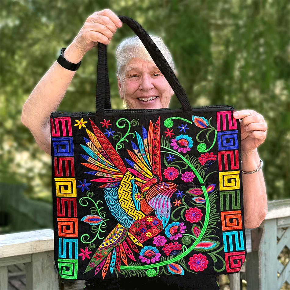 Large black cotton tote bag with detailed embroidery of birds, colorful.