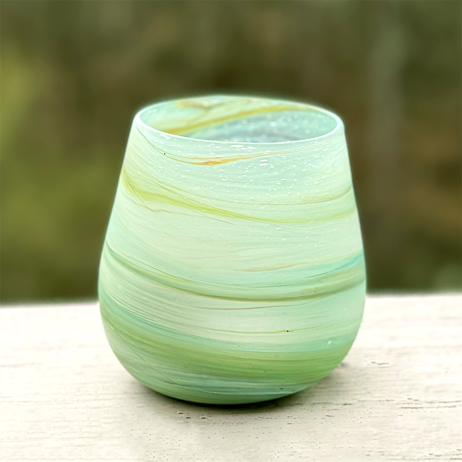 Light green blue glass candle holder with votive and sand