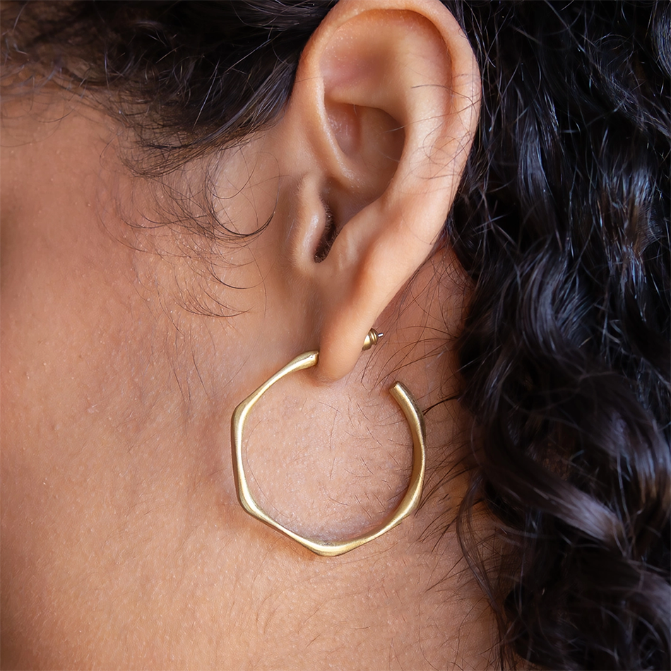 Gold-plated hoop stud-style earrings with unique shape.