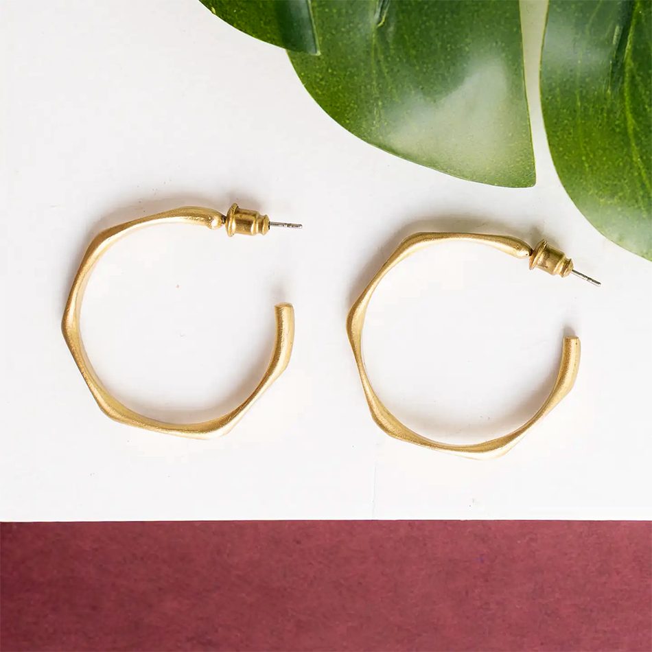 Gold-plated hoop stud-style earrings with unique shape.