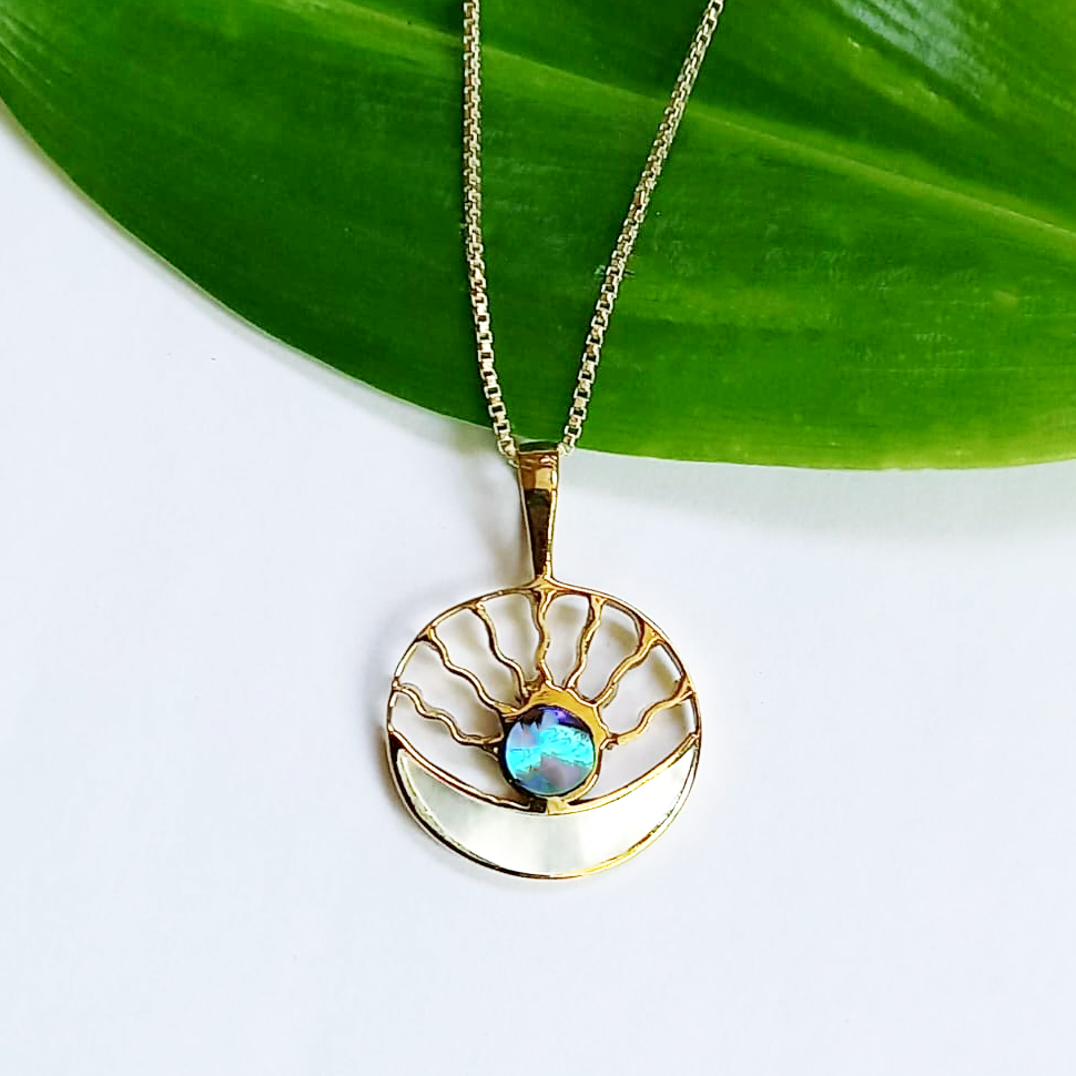 Brass round pendant with sun moon design and pearl and abalone