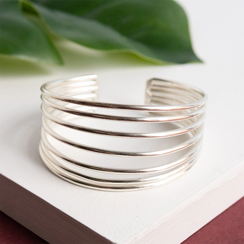 Wide silver-plated statement cuff bracelet with 7 bands.  