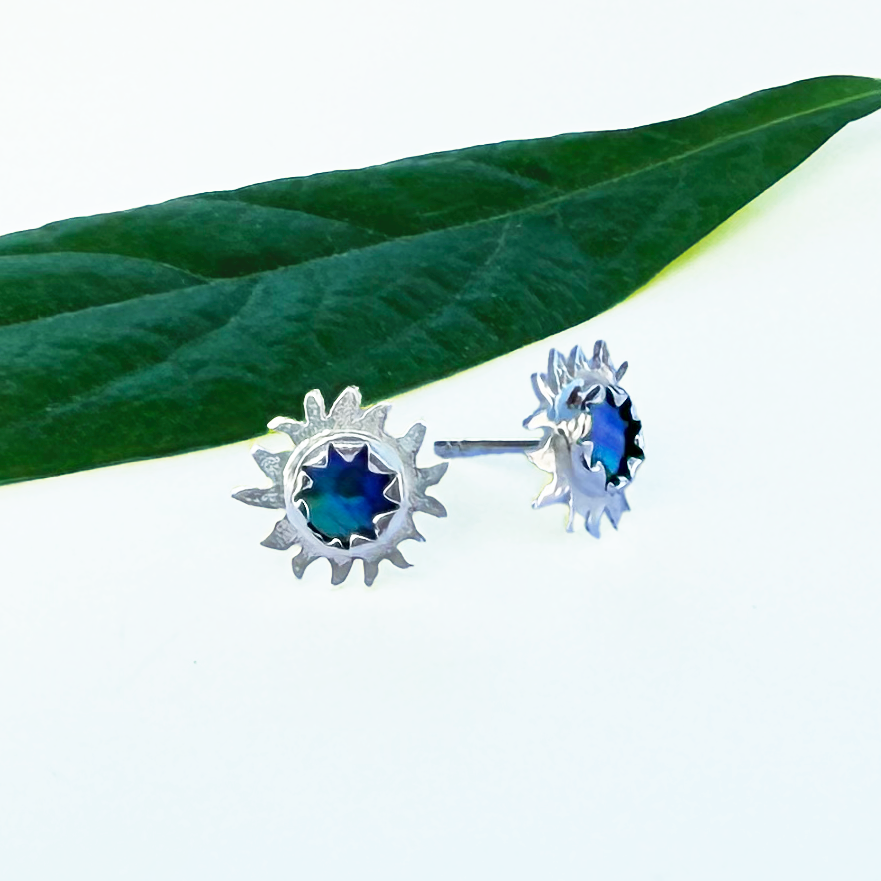 Sterling silver sun studs with abalone in center
