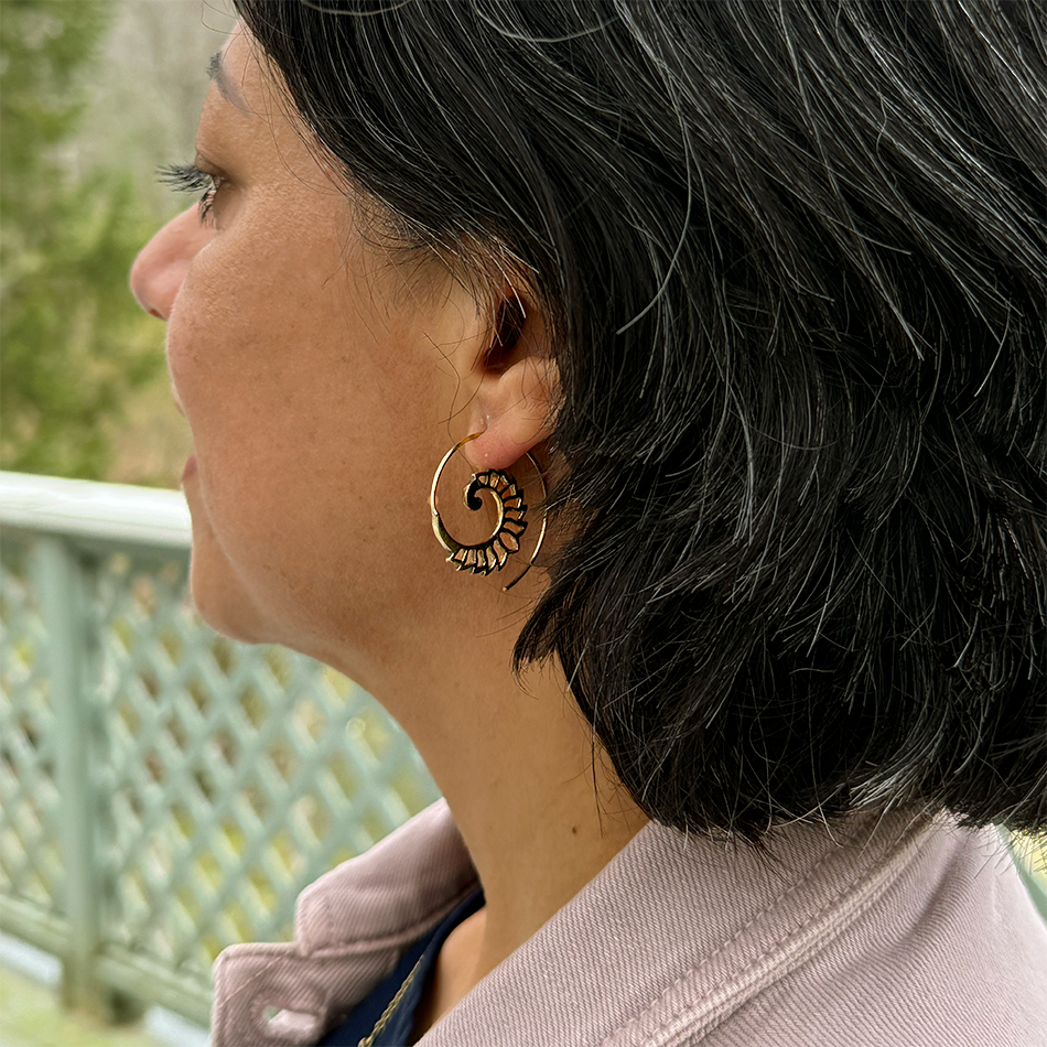 Brass spiral earrings with cutout design