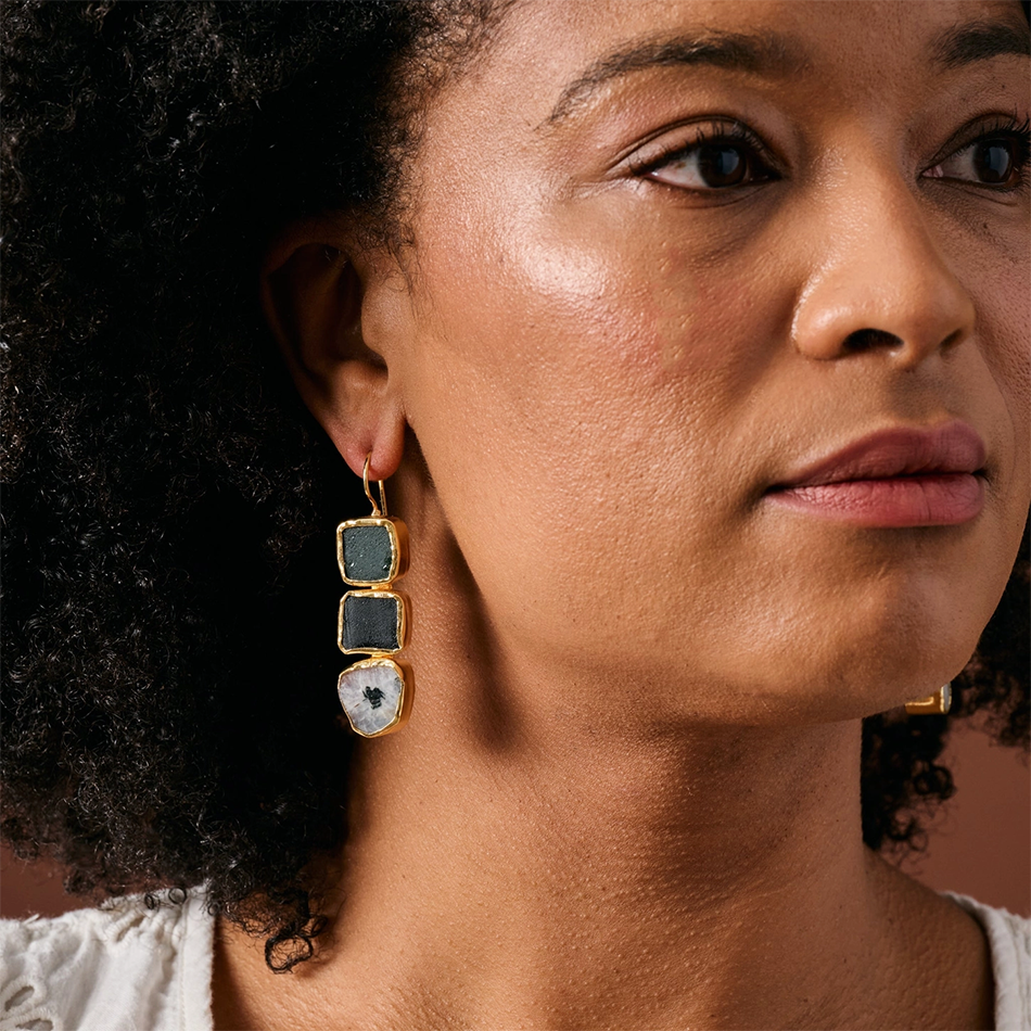 Large dangle earrings with 3 colored stones on gold.