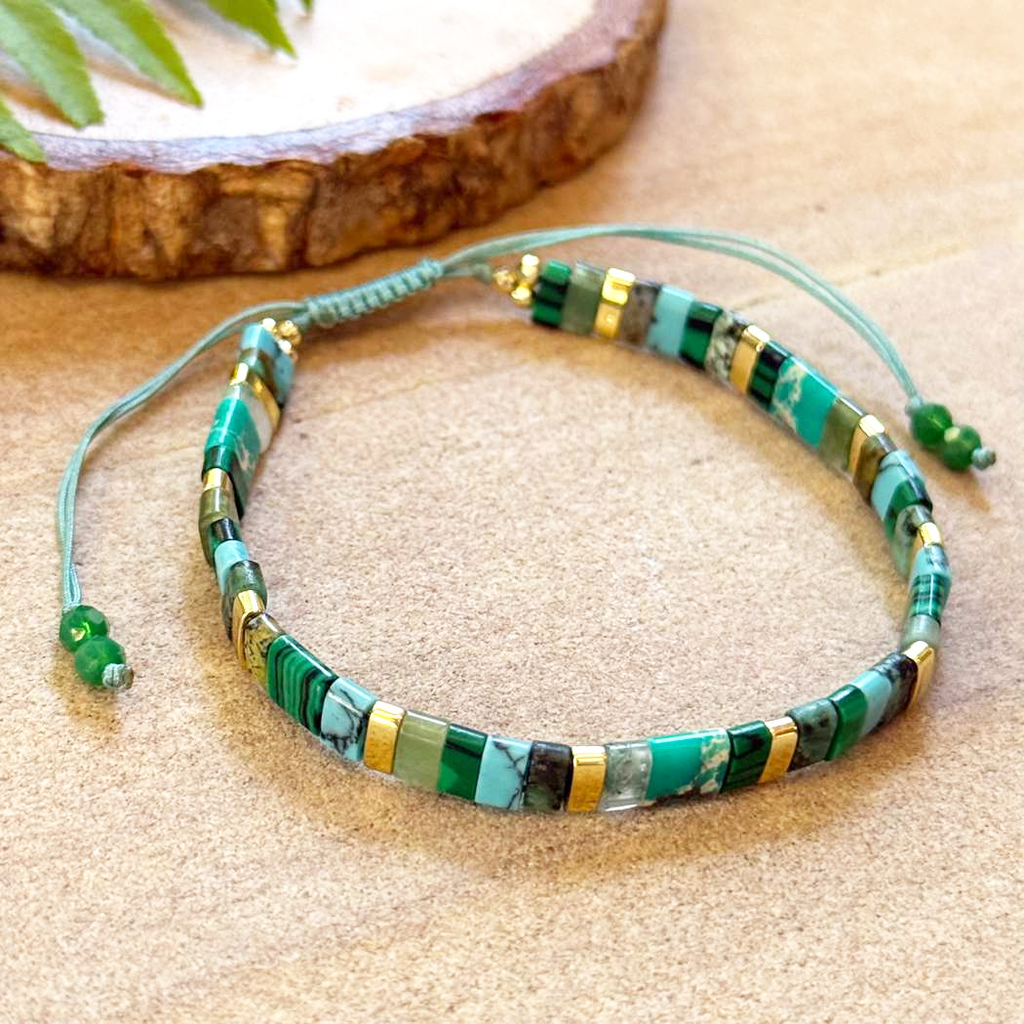 Blue and brass stone beaded bracelet on adjustable cord
