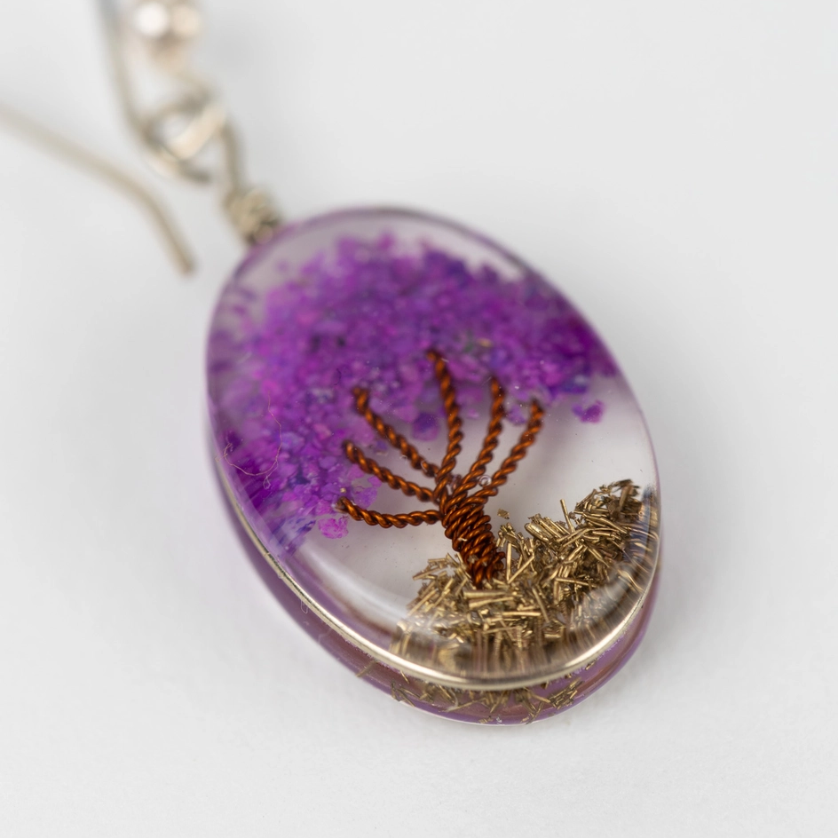 Resin purple tree earrings close up