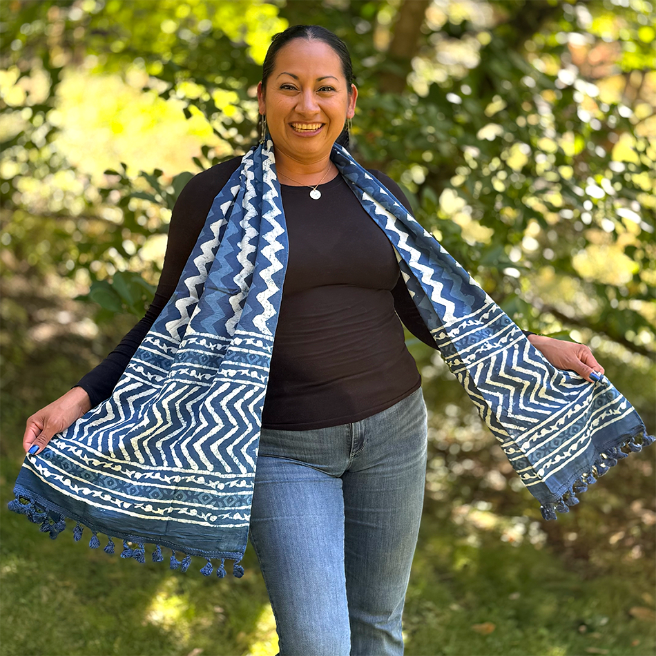 Fair trade indigo cotton scarf with zig zag design and pom poms.