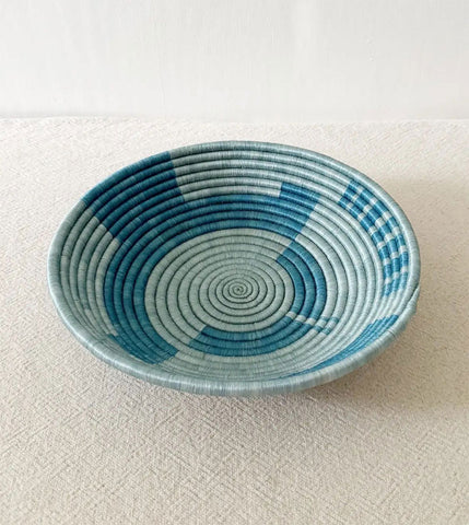 Fair trade sisal sweetgrass bowl basket in blue colors handmade in Rwanda.