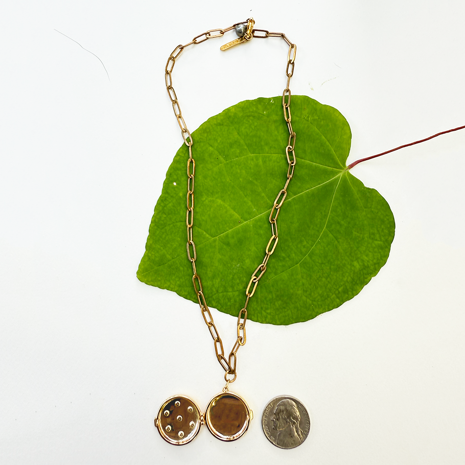 Fair trade gold-plated locket with crystal stars.