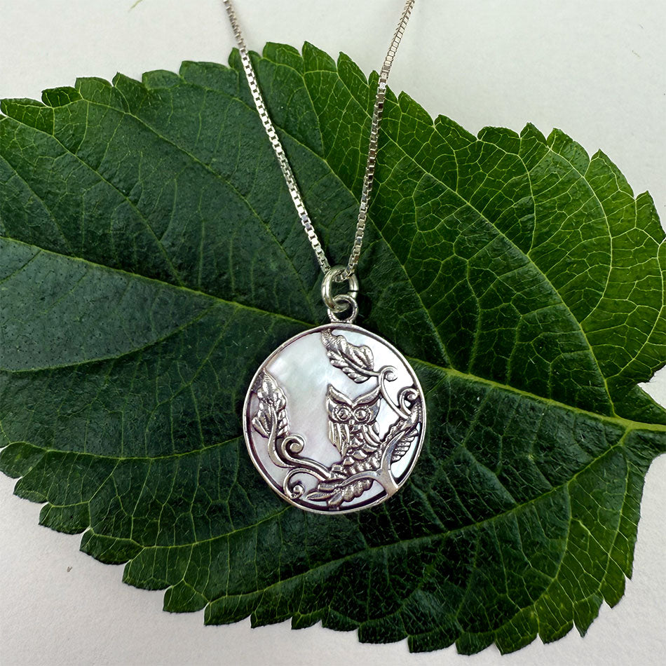 Fair trade mother-of-pearl sterling silver owl necklace.