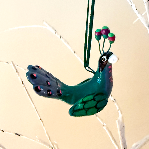 Hand-painted ceramic peacock ornament