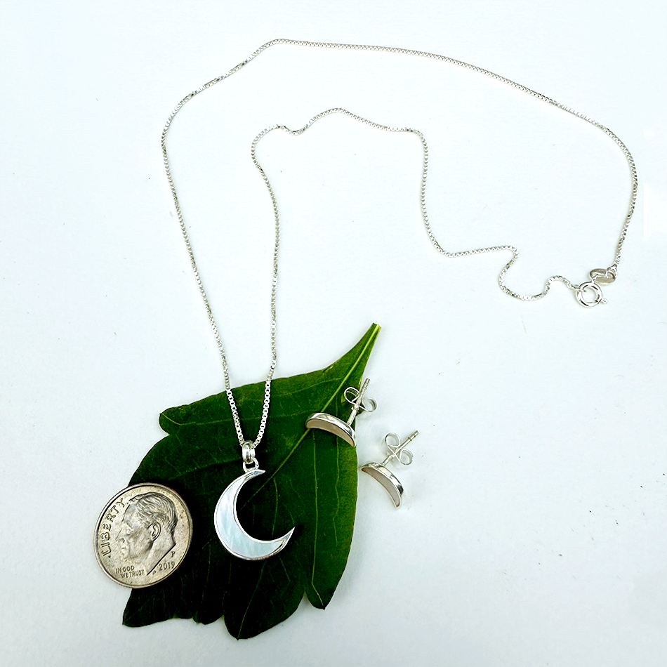 Mother-of-pearl crescent moon sterling silver necklace with silver box chain.