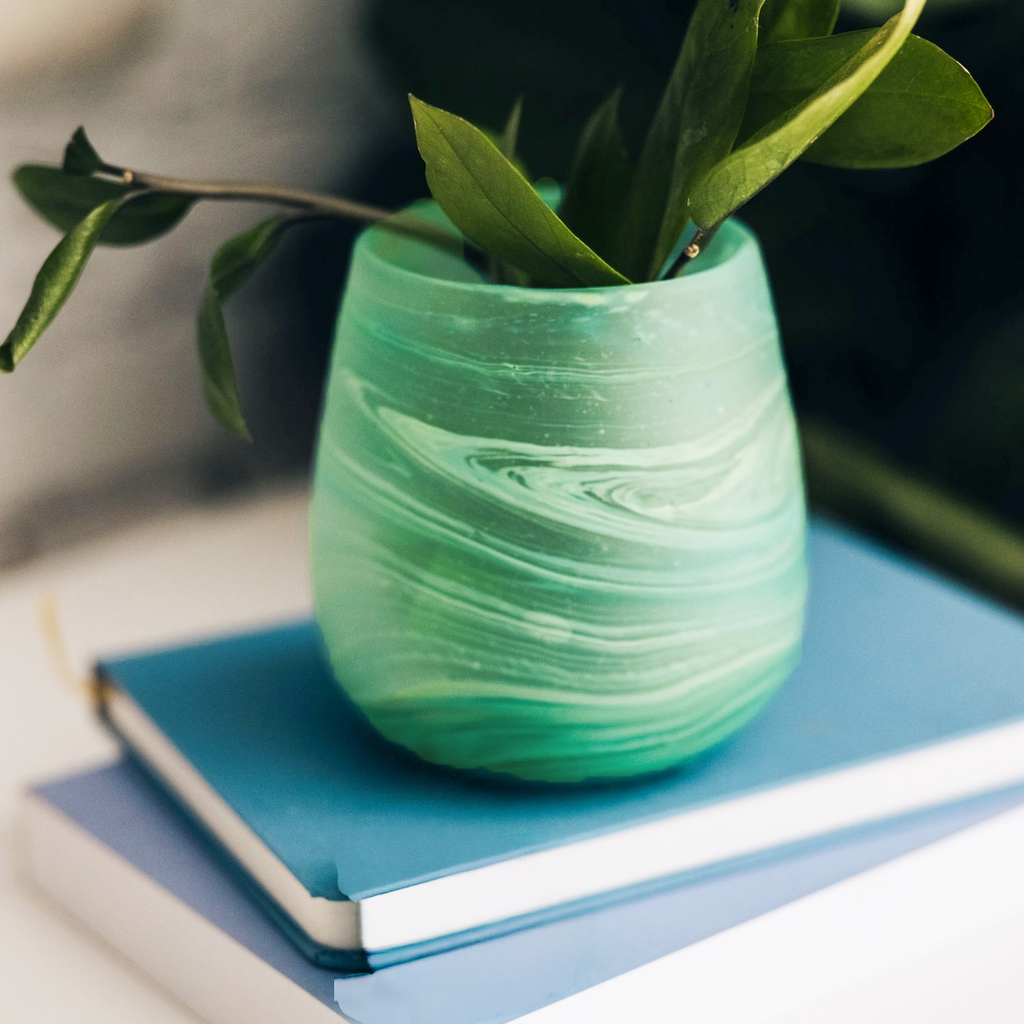 Light green blue glass candle holder with votive and sand