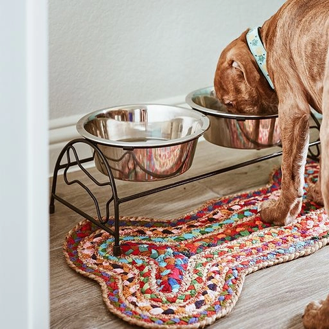 Handwoven recycled rug for dog feeding in bone shape and multicolored.