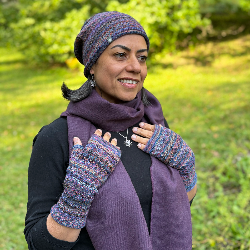 Fair trade baby alpaca knitted hat and fingerless gloves with purple, pink, blue and more colors.