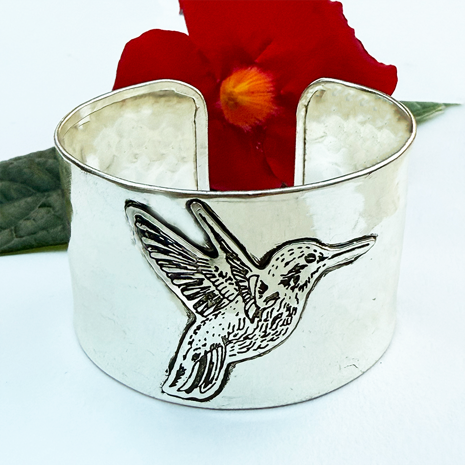 Fair trade silver hummingbird wide cuff bracelet.
