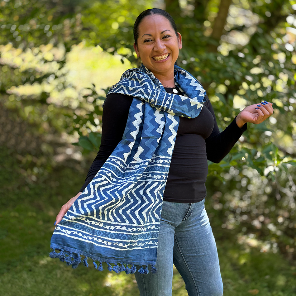 Fair trade indigo cotton scarf with zig zag design and pom poms.
