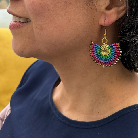 Colorful cotton and brass macrame earrings with brass spiral in center.