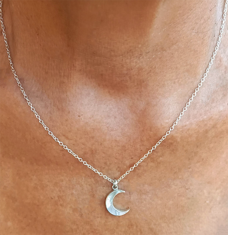 Mother-of-pearl crescent moon sterling silver necklace with silver box chain.