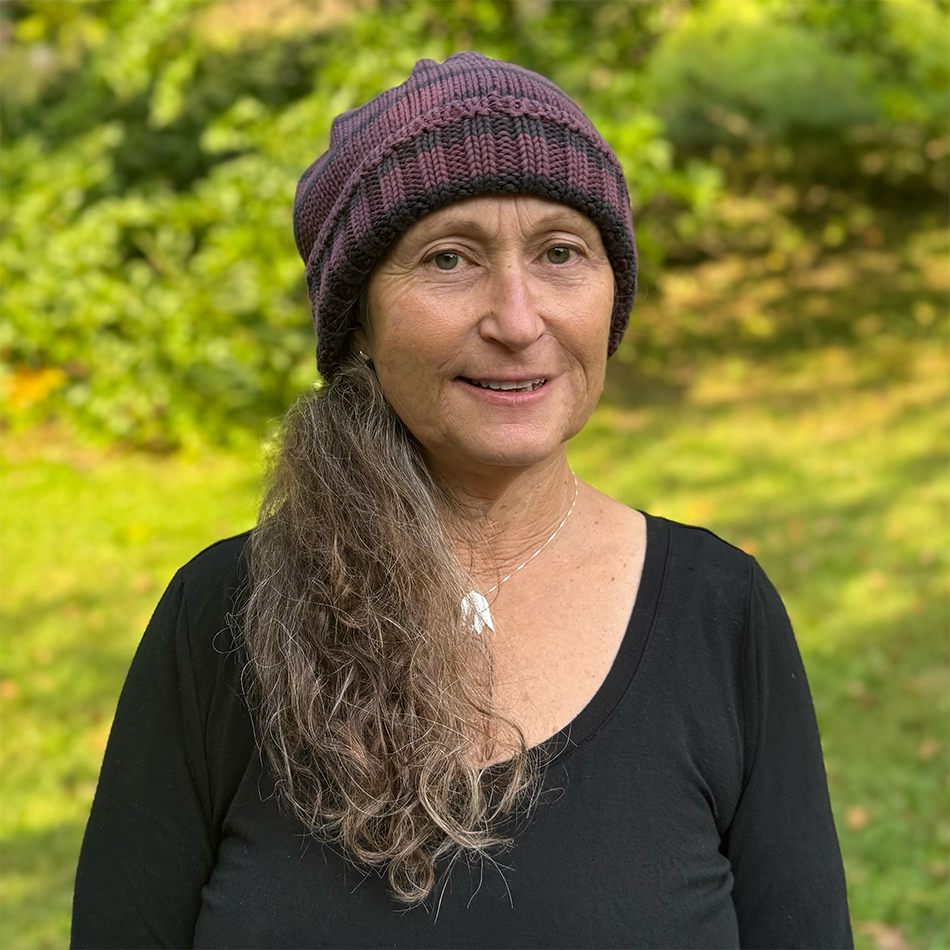Organic cotton fair trade hat with purple and black stripes.