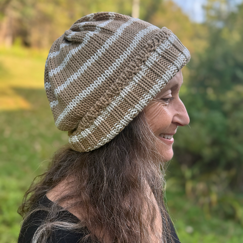 Fair trade organic cotton hat with tan and white stripes.