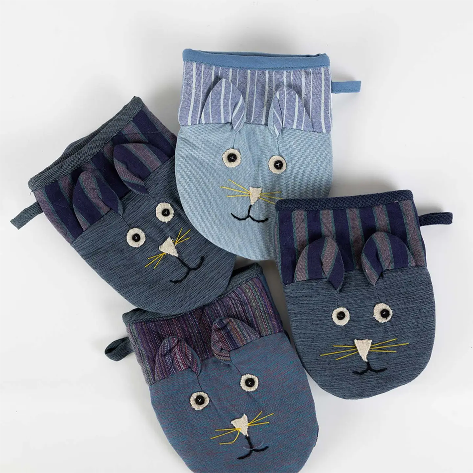 Set of 2 fair trade oven mitts with a cat design in blue colors.