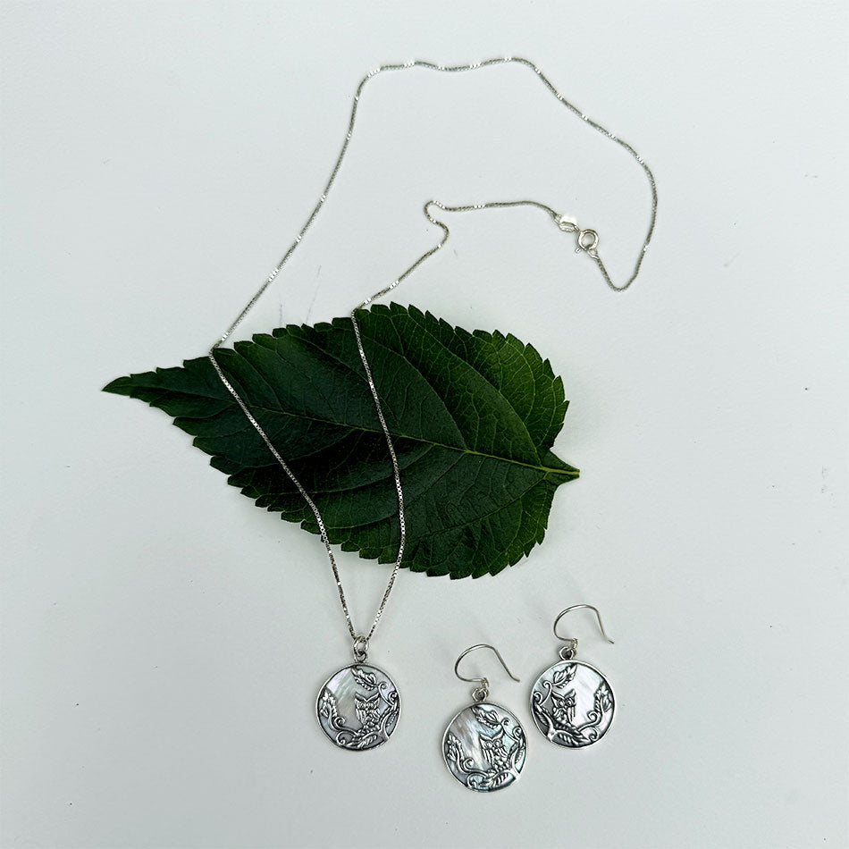 Fair trade mother-of-pearl sterling silver owl necklace.