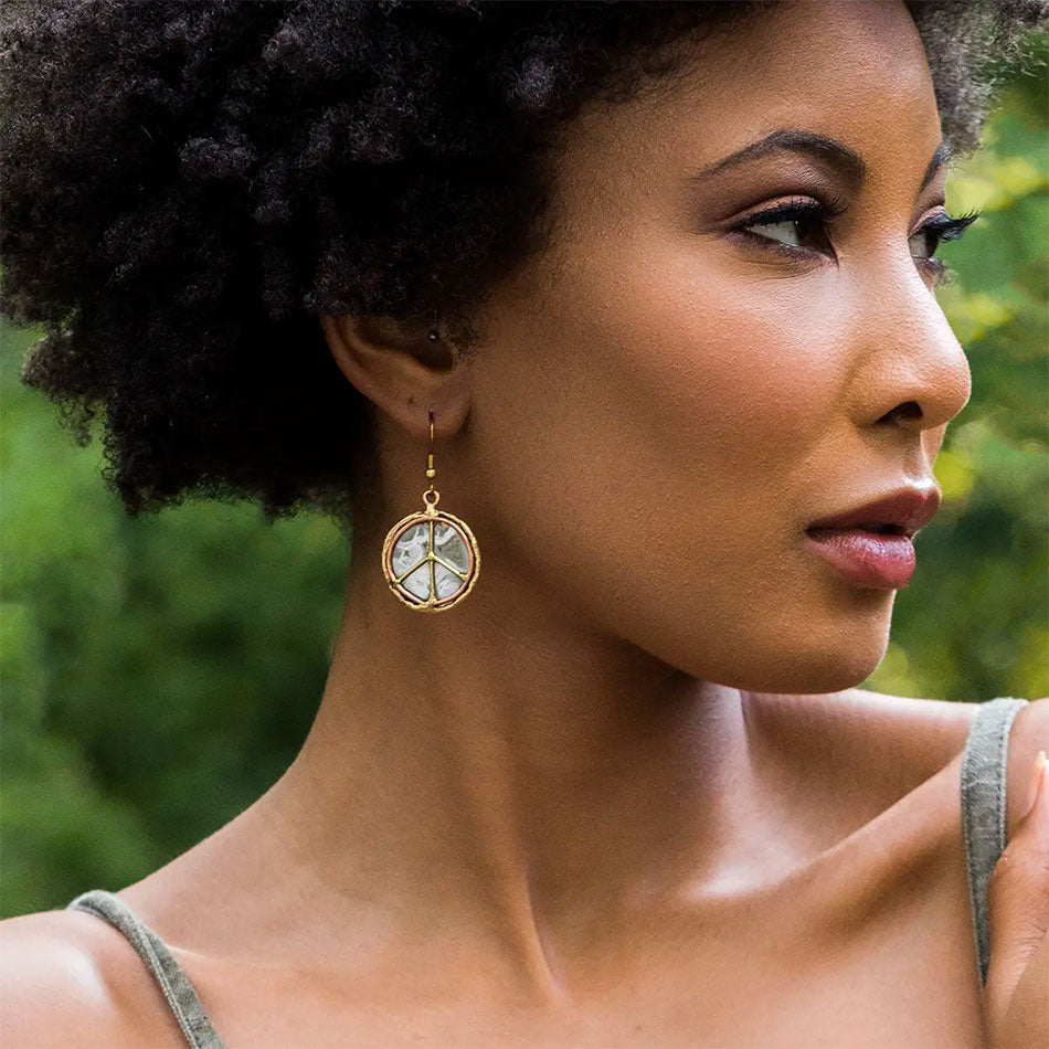 Fair trade peace sign earrings in brass, copper and stainless steel.