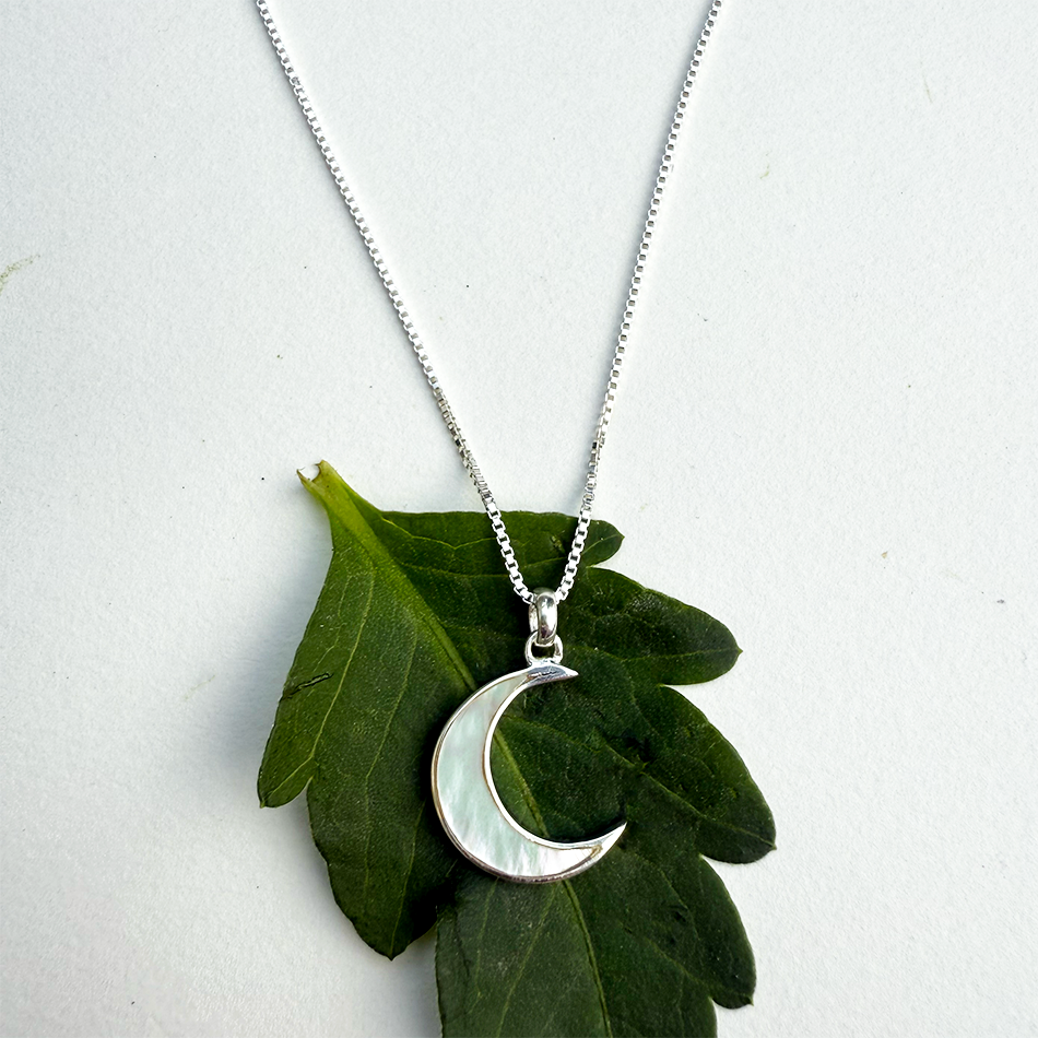 Mother-of-pearl crescent moon sterling silver necklace with silver box chain.