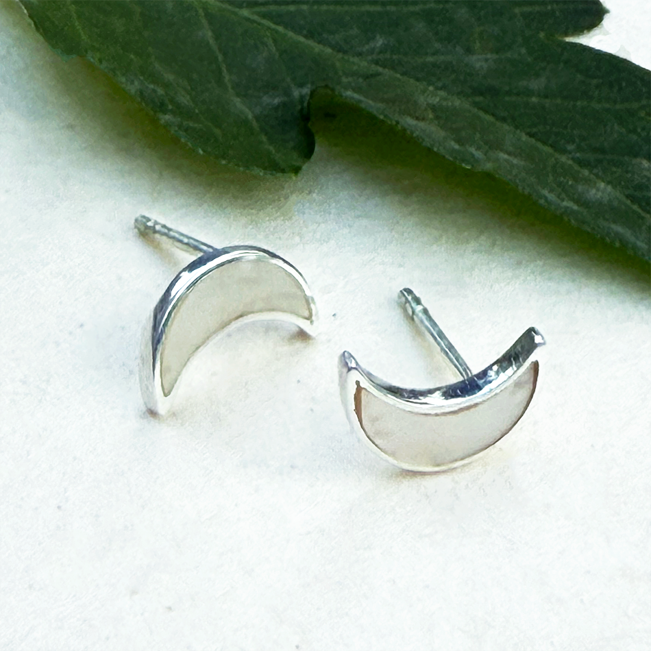 Sterling silver mother-of-pearl crescent moon studs earrings.