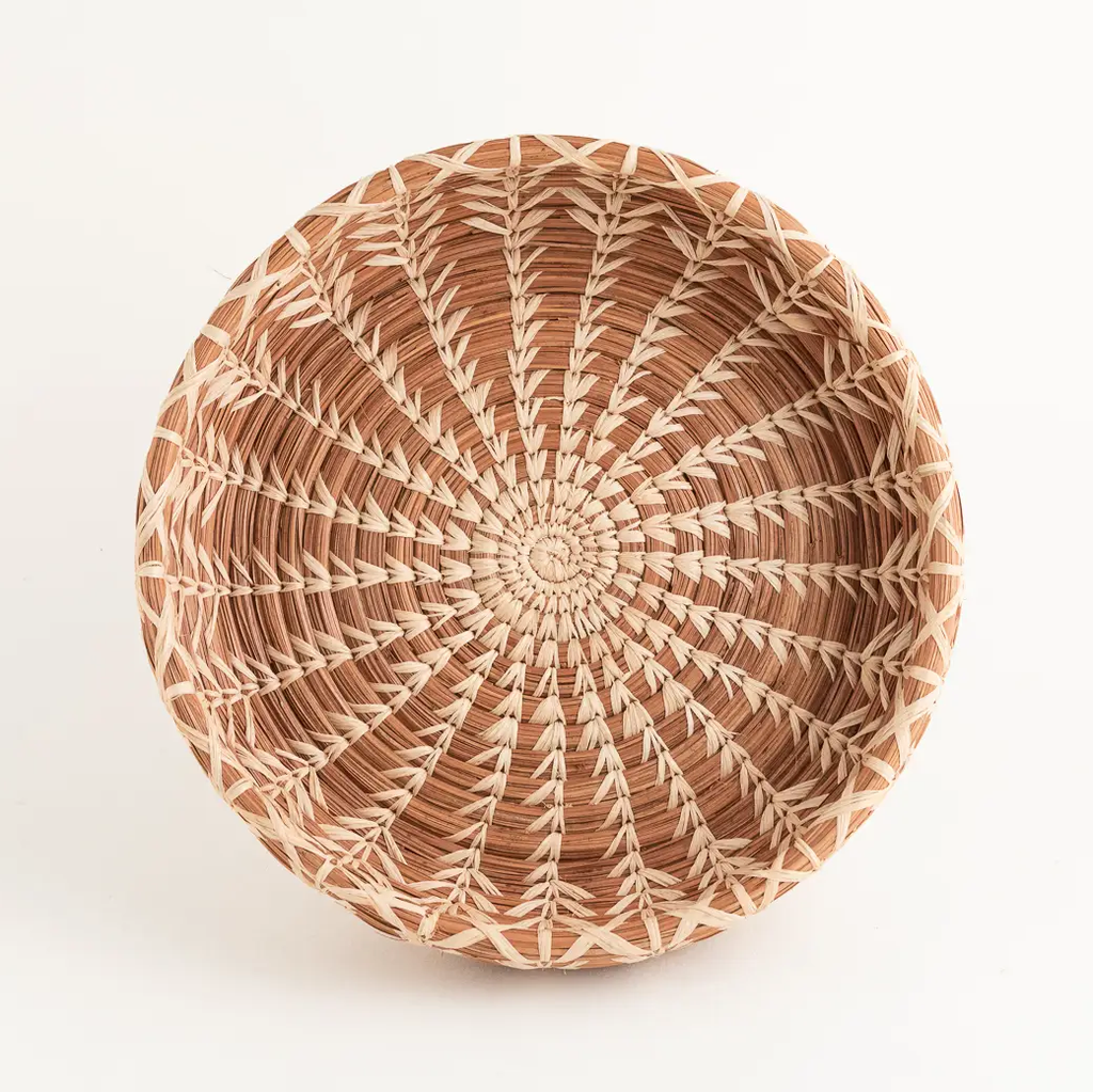 Fair trade small basket made out of pine needles and natural color.