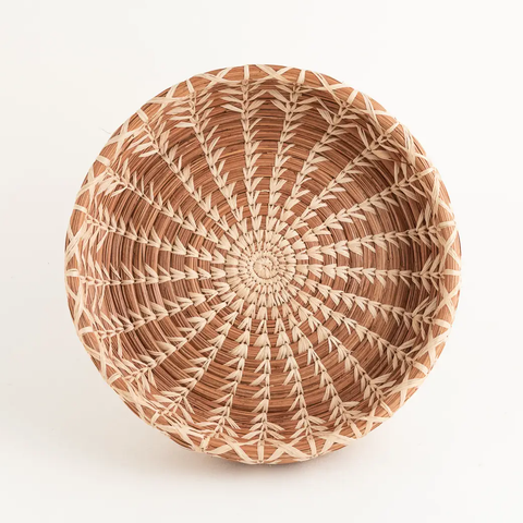 Fair trade small basket made out of pine needles and natural color.