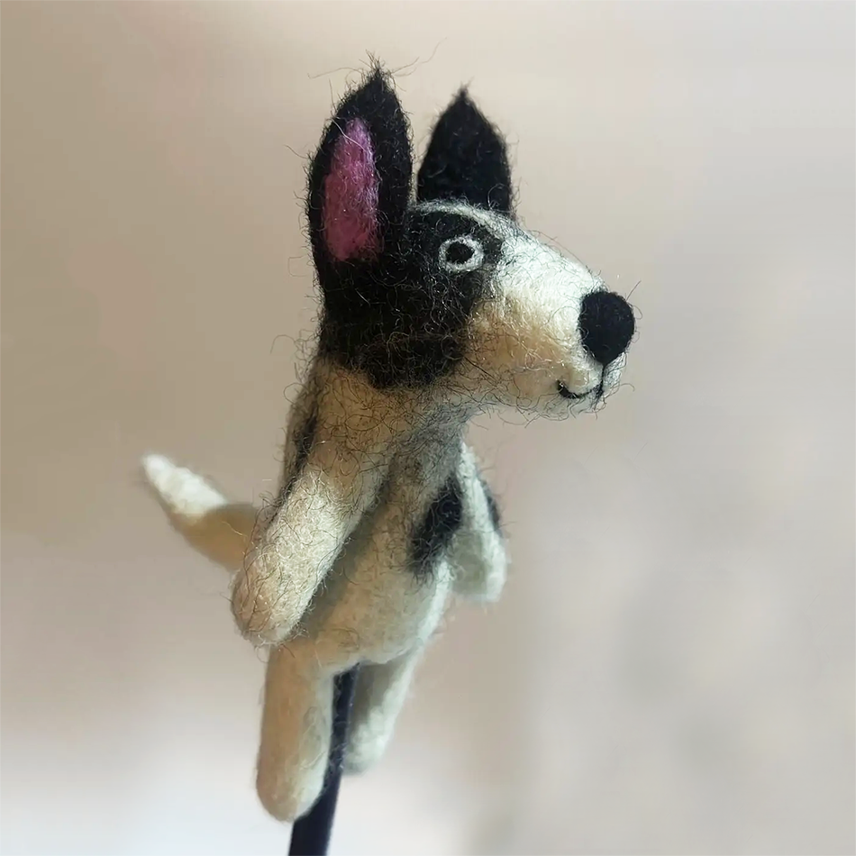 Fair trade dog finger puppet handmade and felted by women in Nepal