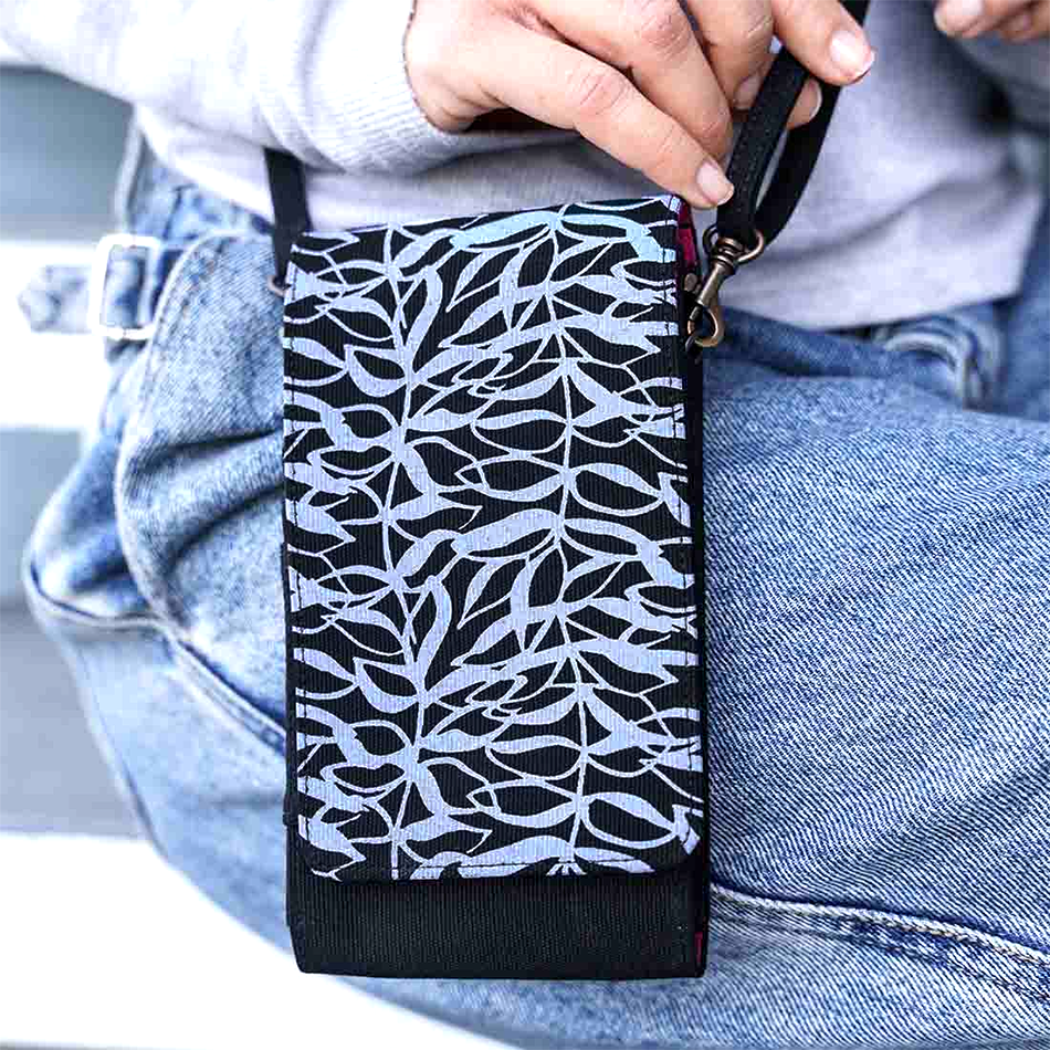 Recycled cotton cell phone bag handmade by human trafficking survivors in Cambodia.
