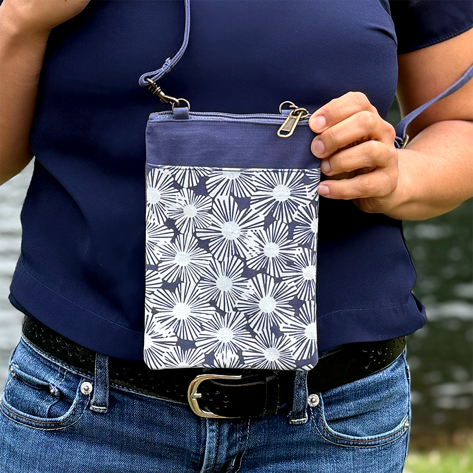 Recycled cotton small crossbody bag with blue and off white flowers.