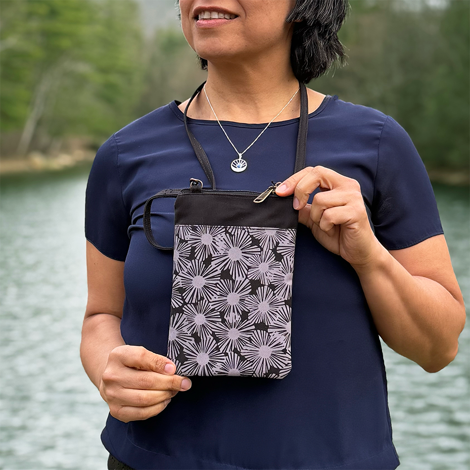Recycled cotton small crossbody bag with black and tan flowers.