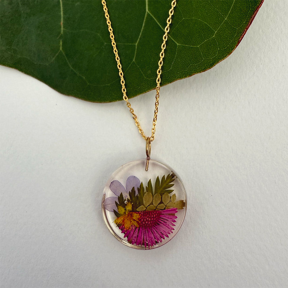 Fair trade eco resin botanical necklace handmade by artisans in Colombia.