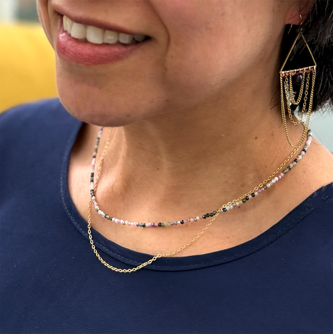 Necklace with 2 strands, one with tiny tourmaline stones the other a gold-plated chain.