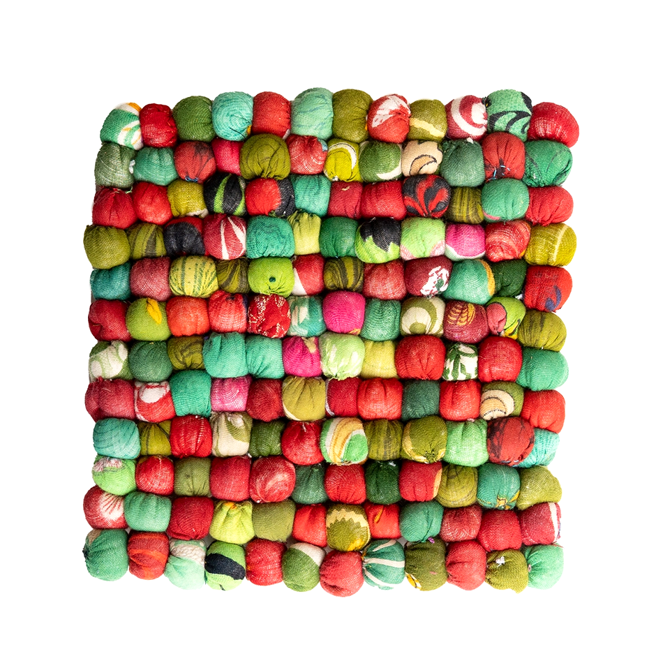 Fair trade trivet made out of recycled sari beads in reds and blues for the holidays.