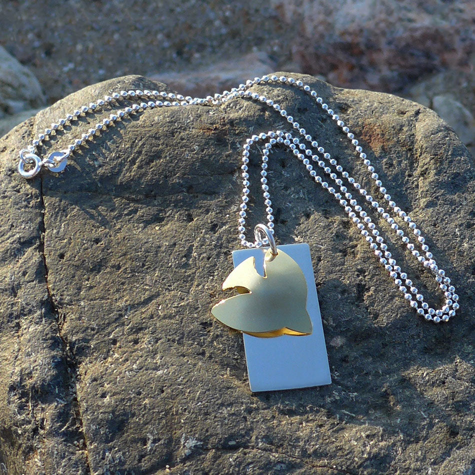 Fair trade sterling silver dove necklace handmade by survivors of human trafficking.