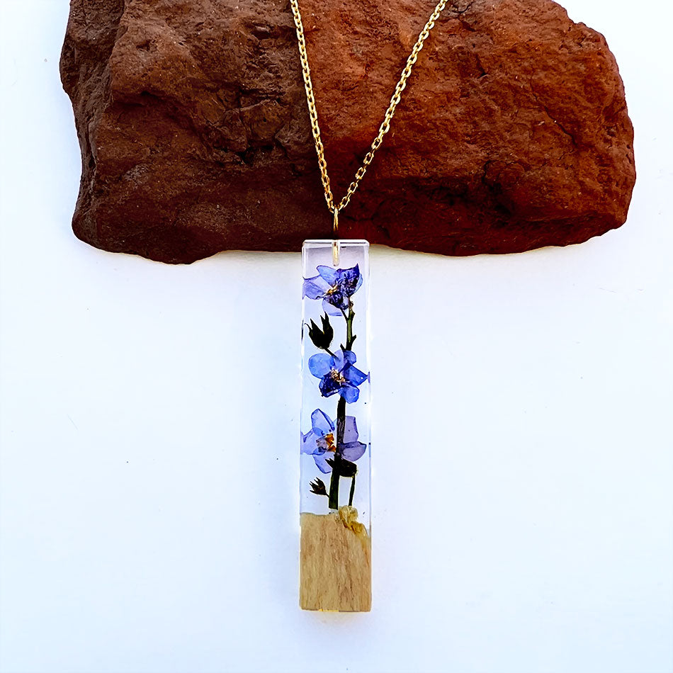 Fair trade flower resin necklace handmade by women artisans in Colombia