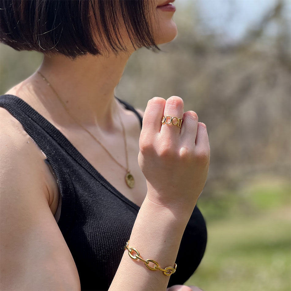 Gold cuff bracelet handmade by survivors of human trafficking