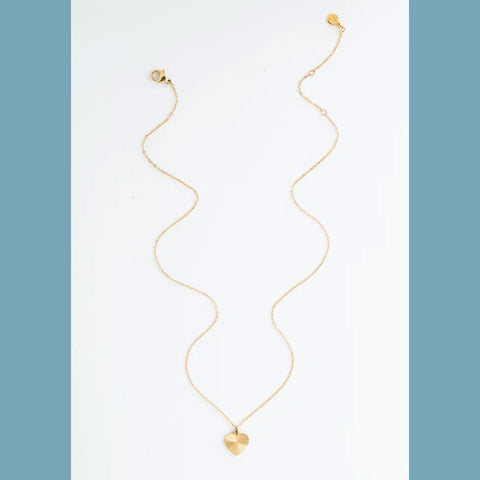 Fair trade gold heart necklace handmade by survivors of human trafficking