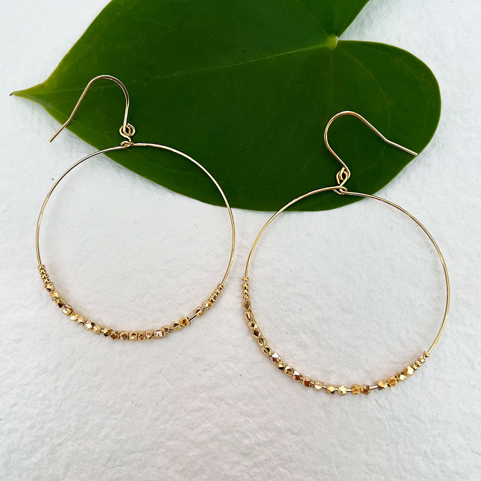 Fair trade brass earrings handmade by survivors of human trafficking
