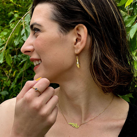 Fair trade olive branch pendant handmade by survivors of human trafficking
