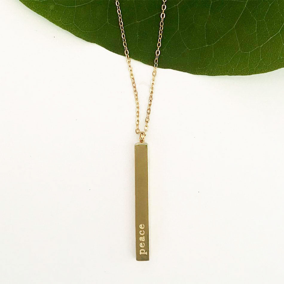 Fair trade bar necklace handmade by survivors of human trafficking