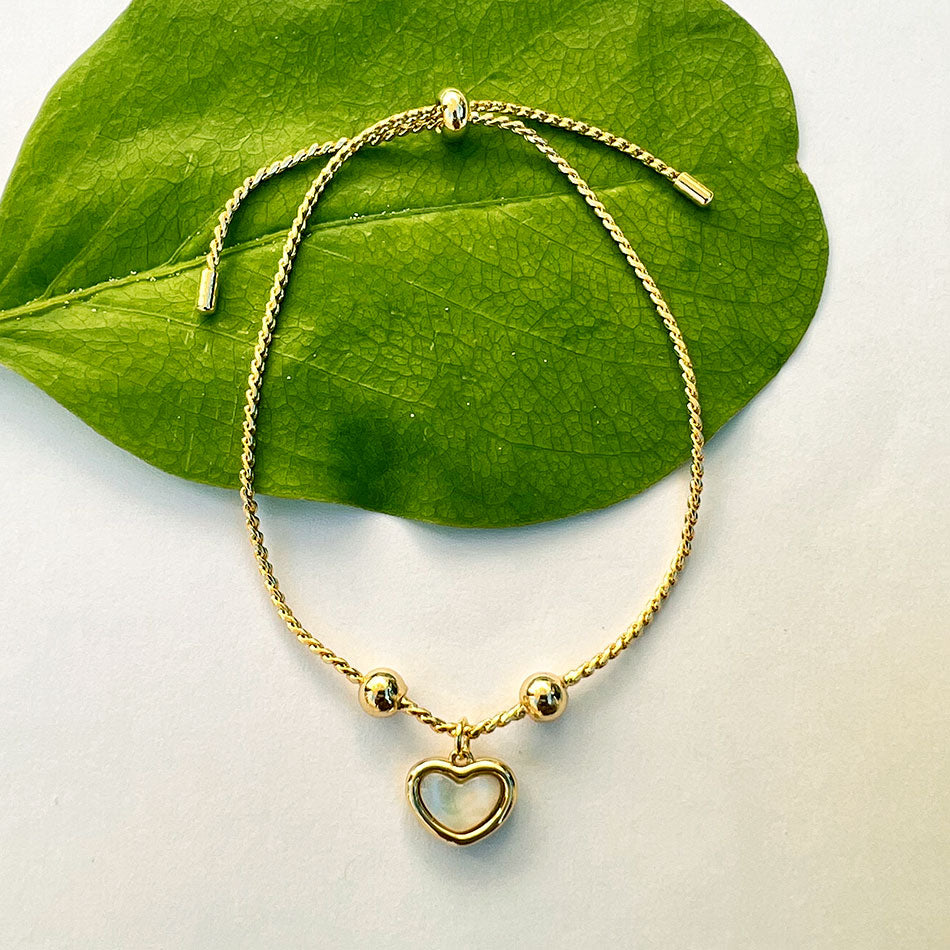 Fair trade pearl heart bracelet handmade by survivors of human trafficking