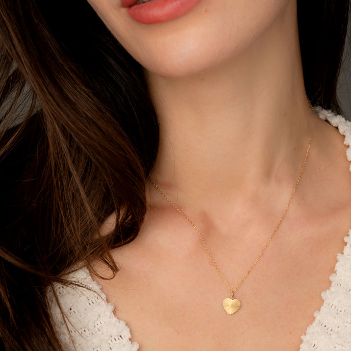 Fair trade gold heart necklace handmade by survivors of human trafficking